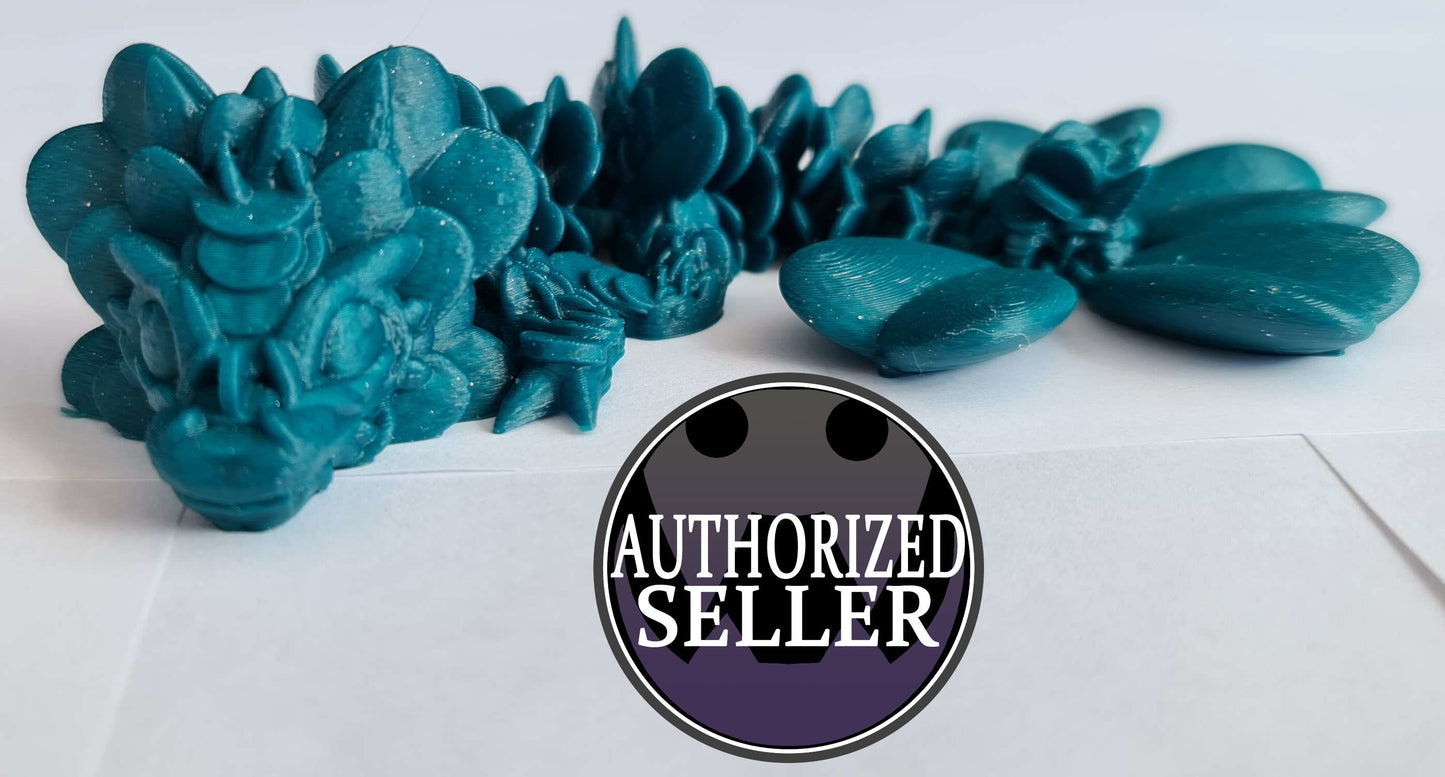 Blue 3D printed dragon articulated figure on white surface, Authorized Seller badge