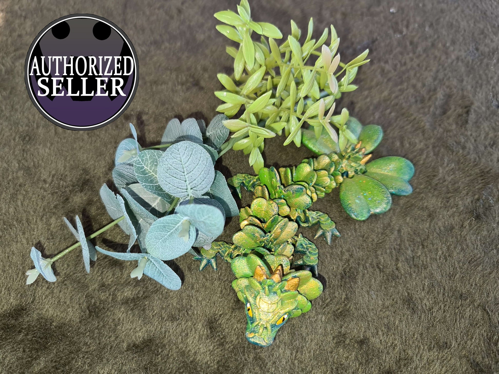 Green dragon figurine with artificial leaves on brown fur, authorized seller badge visible