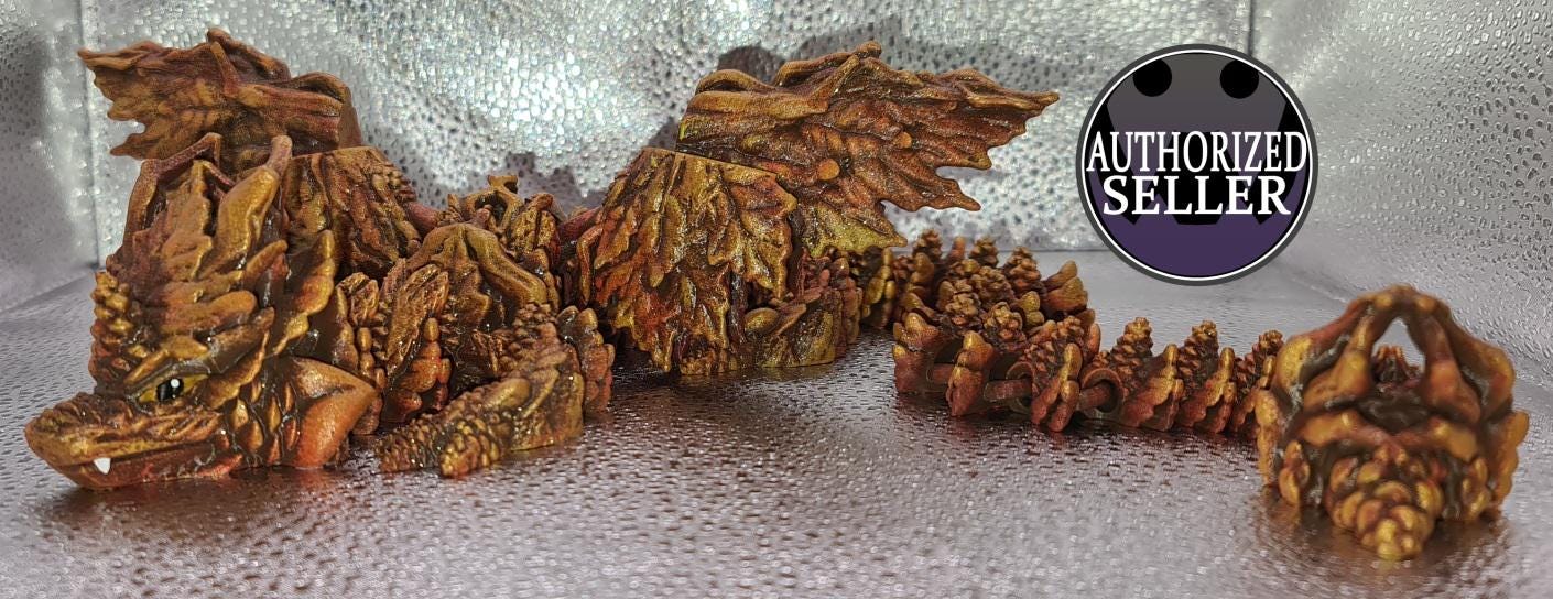 Articulated brown dragon figurine with leaf-like details, silver background, authorized seller badge