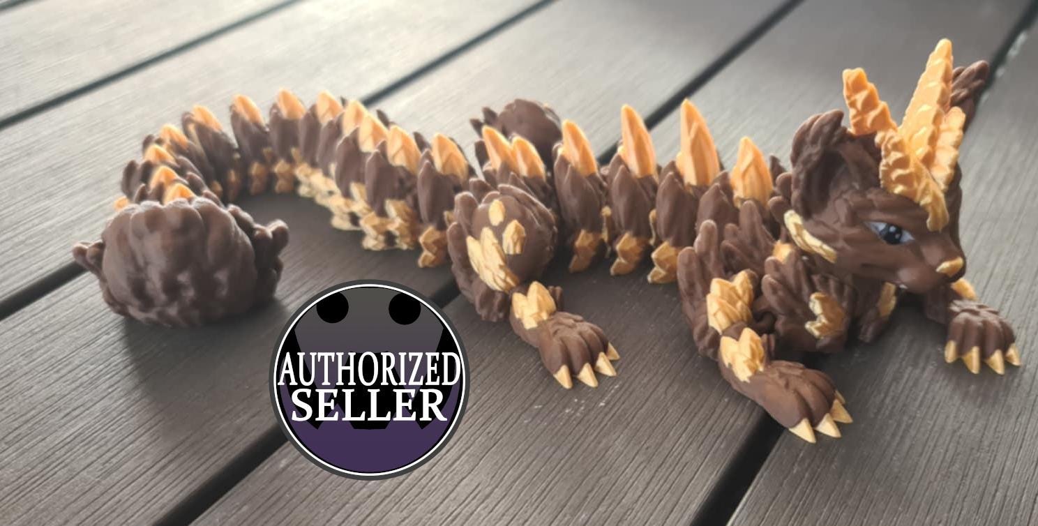 Brown and gold articulated dragon figurine on wood surface, Authorized Seller badge